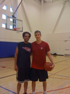 the Secretary of Education, Arne Duncan, and me after a basketball game.